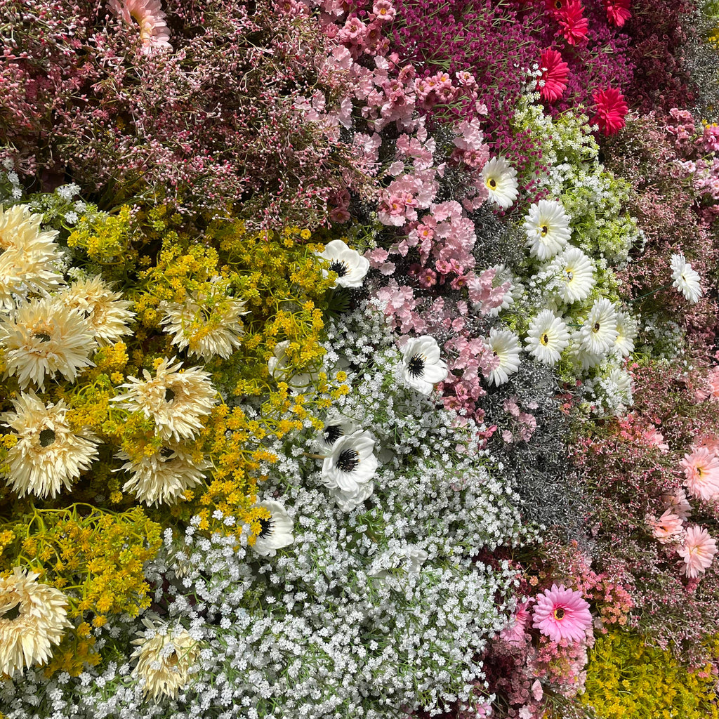 Rose Morning“The flower walls are made of artificial flowers in various colors, layered at different levels to create a lush, elegant and natural look. The exclusive zipper design and roll-up design make it easy to install and remove.”