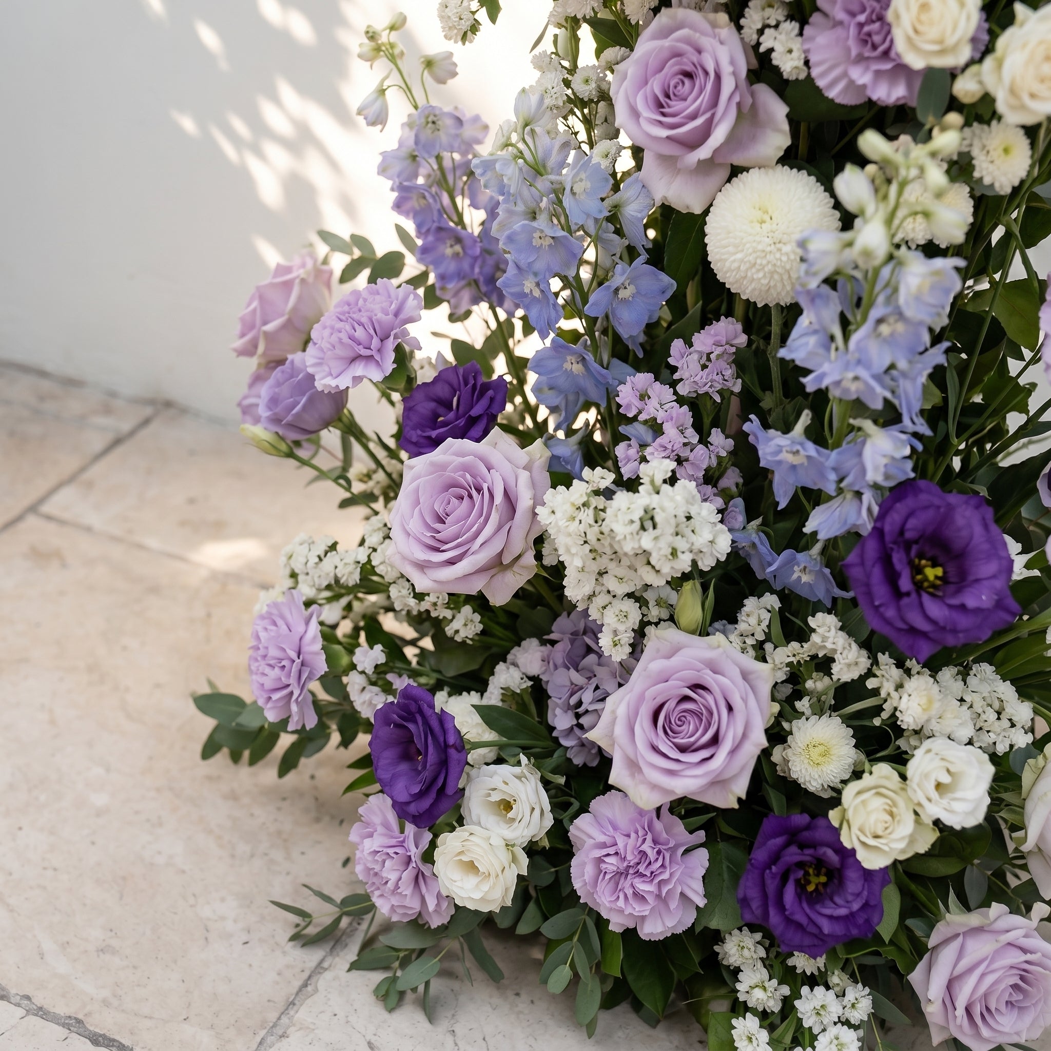 Marmere: Luxury Lavender Purple, Ivory White & Dusty Blue Silk Floral Ground Horn Arch Arrangement with Soft Delphinium & Lush Cascading Greenery for Romantic Minimalist Weddings & Garden Event Decor Including Frame