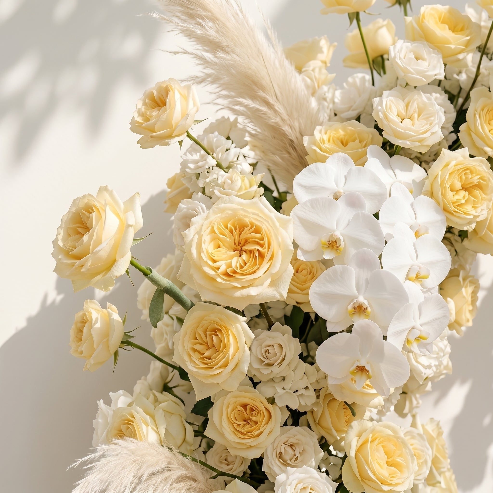 Orelrose: Luxury Soft Yellow Cream, Pure White & Ivory Silk Floral Ground Horn Arch Arrangement with Soft Pampas Grass & Lush Cascading Greenery for Romantic Minimalist Weddings & Garden Event Decor Including Frame